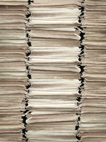 manuscript pages in three stacks